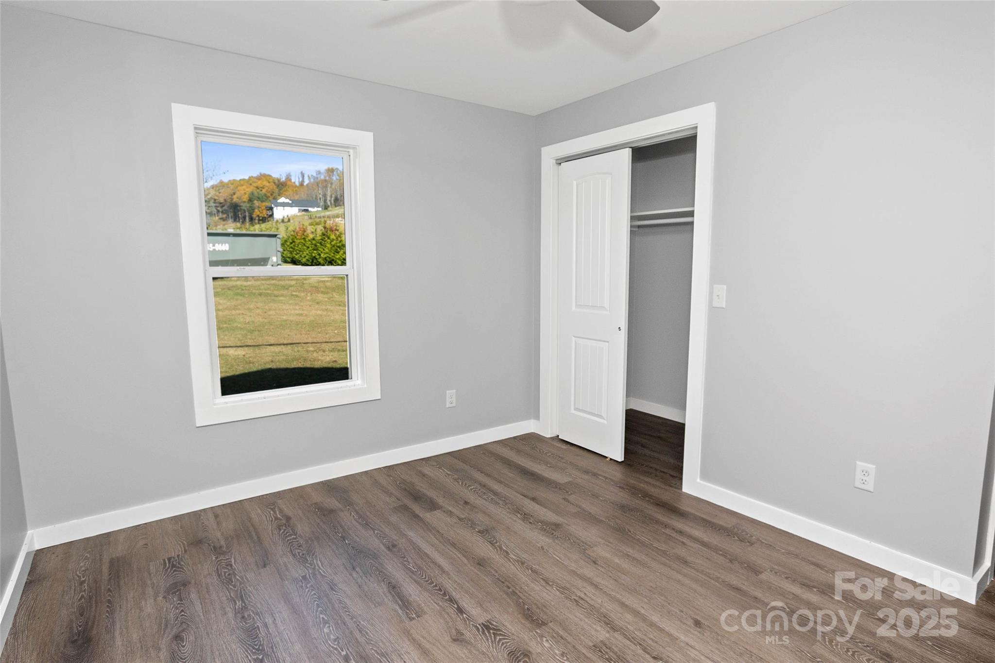 3471 Chimney Rock Road Hendersonville, NC 28792 - Photo 41 of 48 an empty room with wooden floor and a window