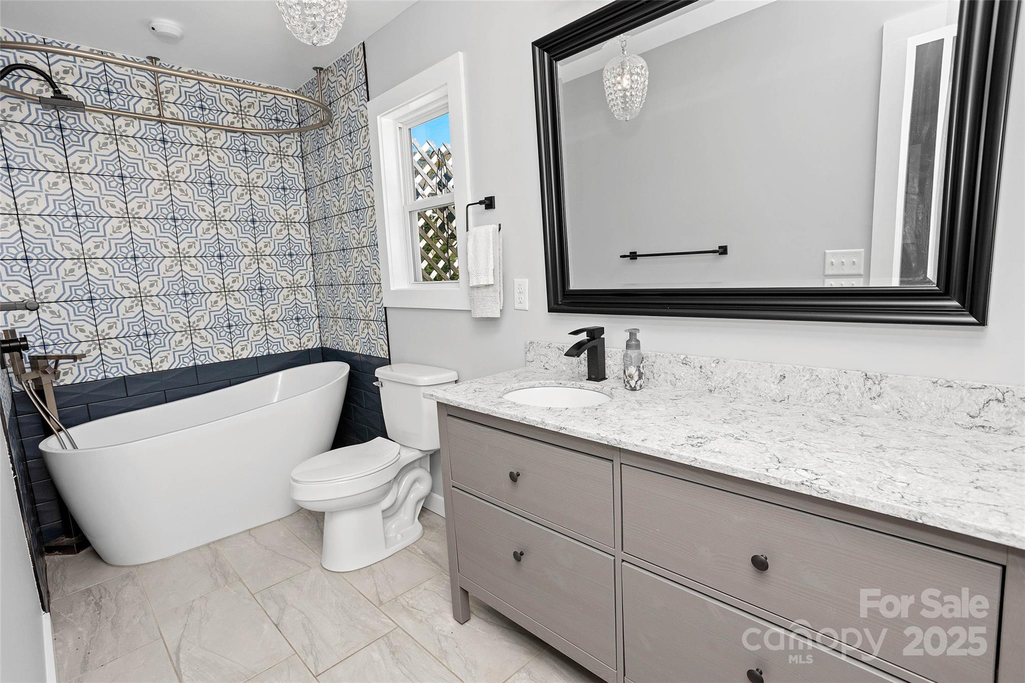 3471 Chimney Rock Road Hendersonville, NC 28792 - Photo 42 of 48 a bathroom with a toilet sink and mirror