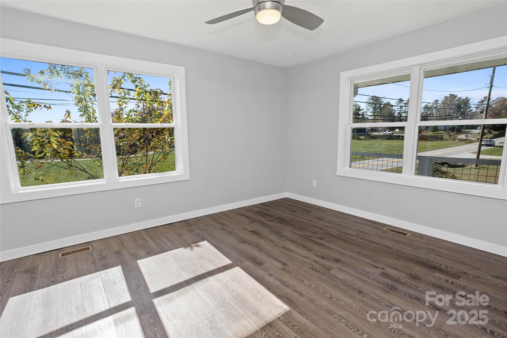 3471 Chimney Rock Road Hendersonville, NC 28792 - Photo 43 of 48 a view of an empty room with wooden floor and a window
