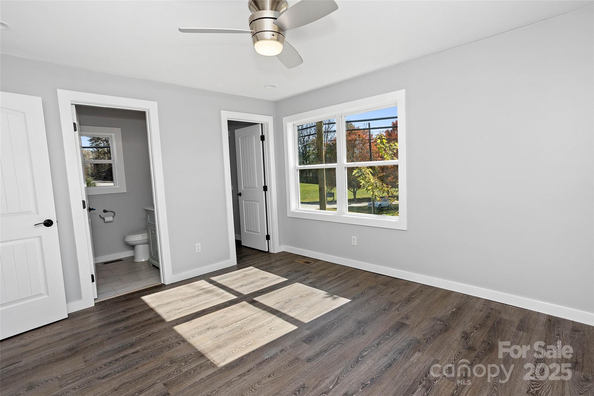 3471 Chimney Rock Road Hendersonville, NC 28792 - Photo 44 of 48 wooden floor in an empty room with a window