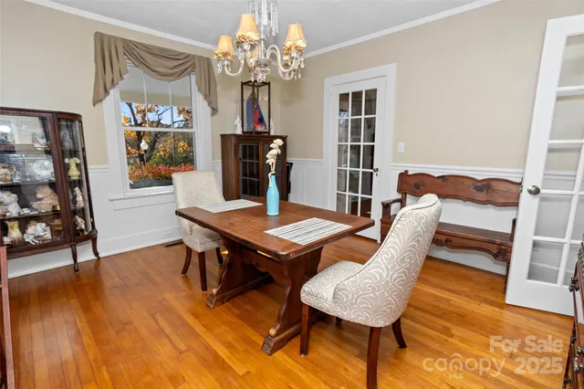 a view of a room with furniture and wooden floor