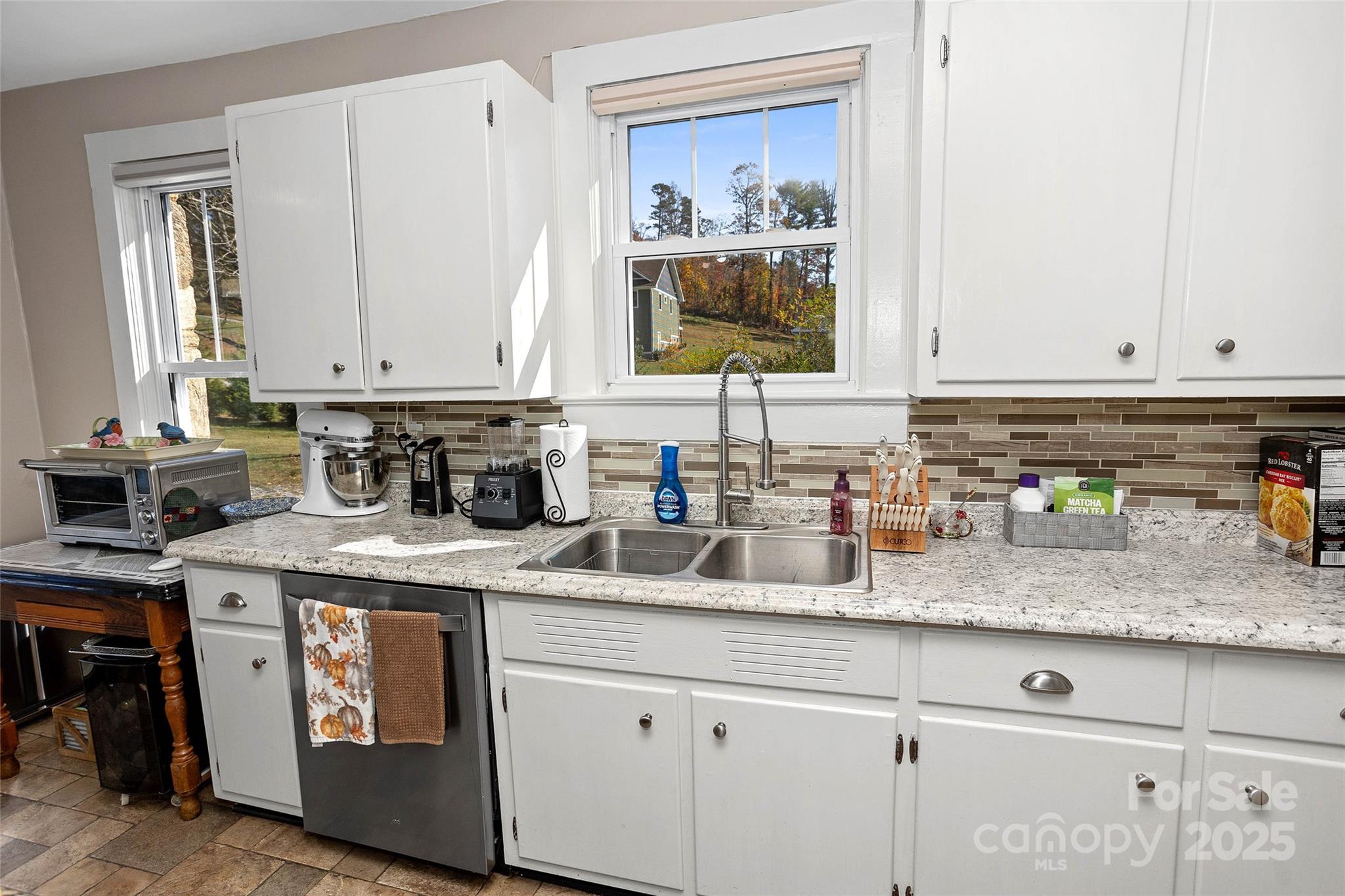 3471 Chimney Rock Road Hendersonville, NC 28792 - Photo 10 of 48 a kitchen with stainless steel appliances granite countertop a sink and cabinets