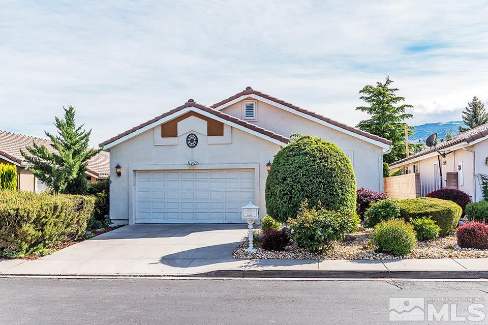 2450 Granite Springs Road Reno, NV 89519 - Photo 1 of 17 a front view of a house with a yard and garage