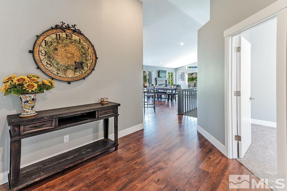 2450 Granite Springs Road Reno, NV 89519 - Photo 2 of 17 an entryway with a flower pot and a bookshelf