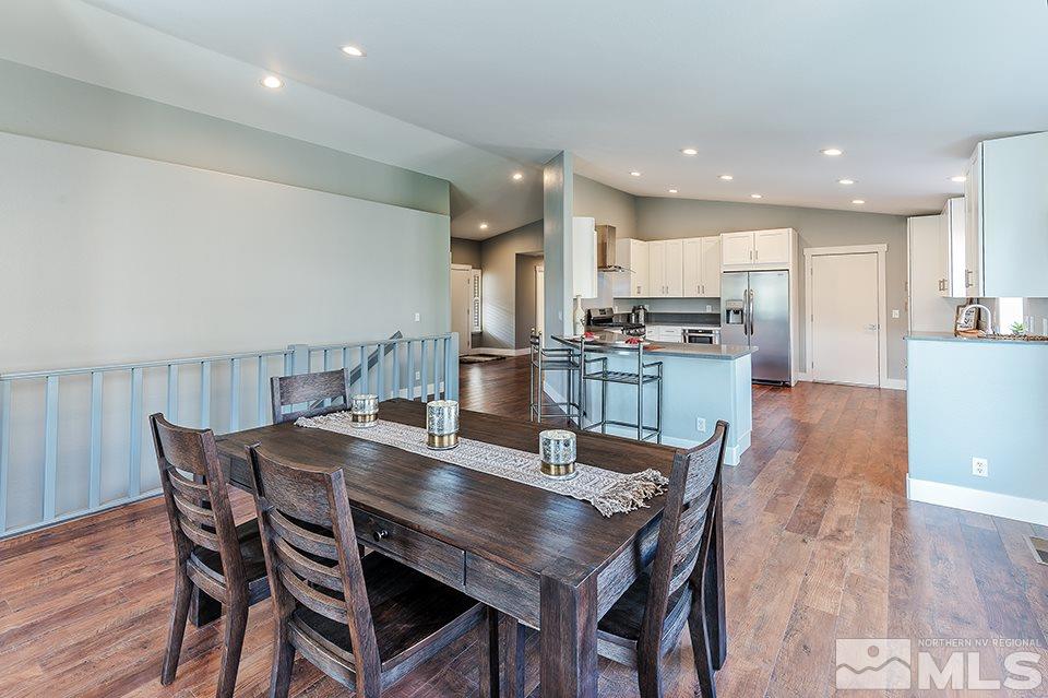 2450 Granite Springs Road Reno, NV 89519 - Photo 7 of 17 a dining room with kitchen island a table and chairs