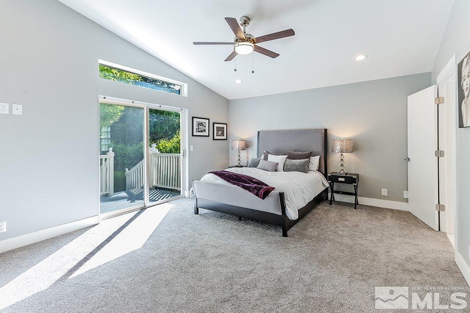 2450 Granite Springs Road Reno, NV 89519 - Photo 8 of 17 a bed sitting in a spacious bedroom next to a window