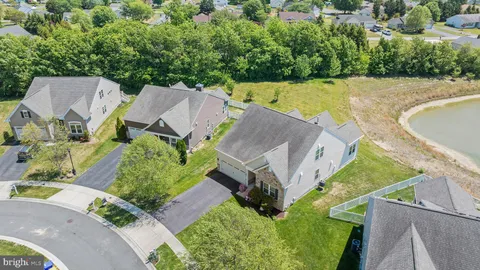 an aerial view of a house with a garden