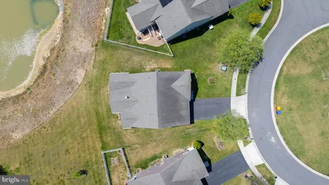 an aerial view of a house with swimming pool