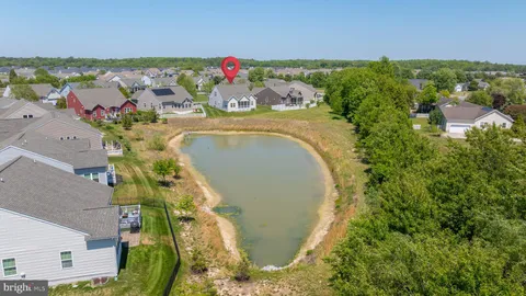 an aerial view of a house with a swimming pool
