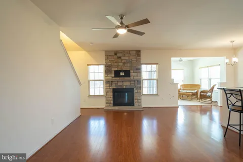 a view of a livingroom with furniture window and wooden floor