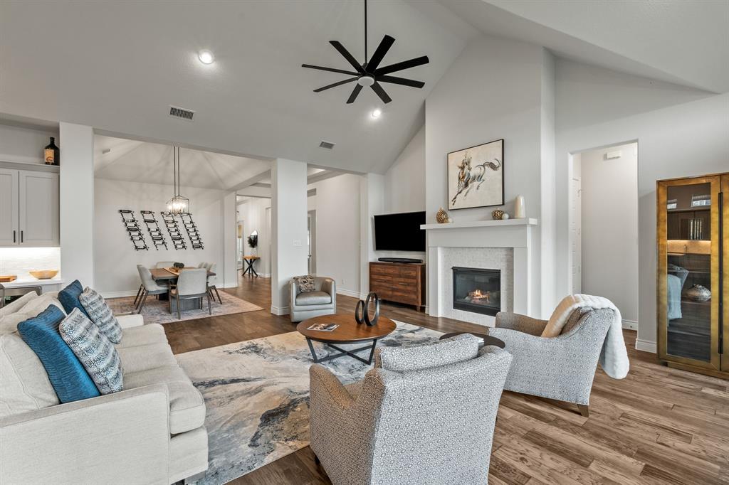 11504 Antler Ridge Way Argyle, TX 76226 - Photo 19 of 40 a living room with fireplace furniture and a large window