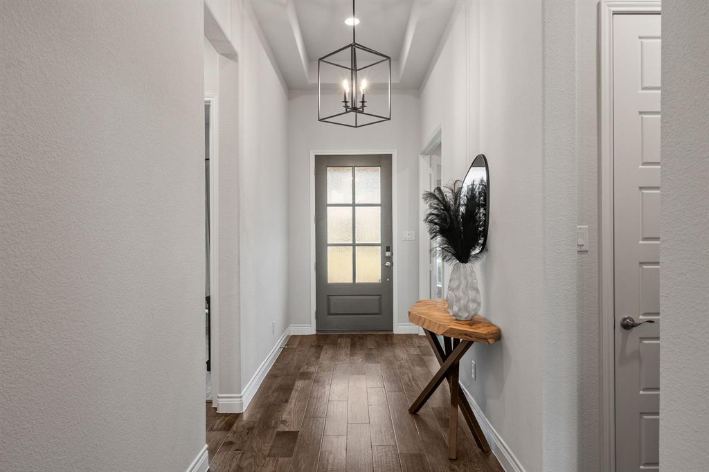 11504 Antler Ridge Way Argyle, TX 76226 - Photo 2 of 40 a view of entryway and hall with wooden floor