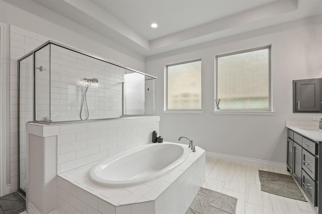 11504 Antler Ridge Way Argyle, TX 76226 - Photo 27 of 40 a bathroom with a sink and a mirror