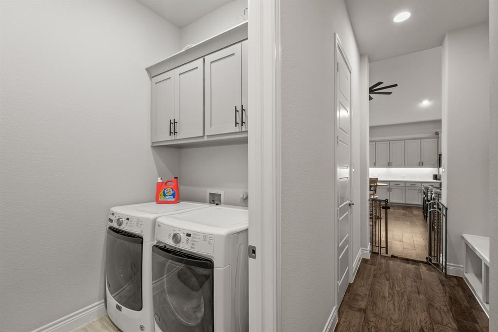 11504 Antler Ridge Way Argyle, TX 76226 - Photo 31 of 40 a utility room with cabinets washer and dryer