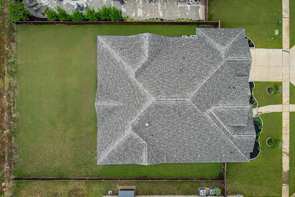 11504 Antler Ridge Way Argyle, TX 76226 - Photo 34 of 40 an aerial view of a house with a yard and lake view
