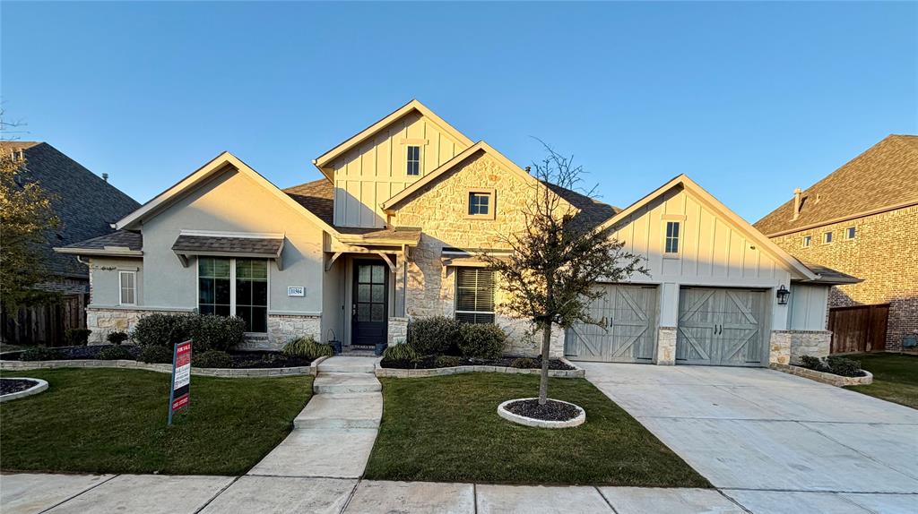 11504 Antler Ridge Way Argyle, TX 76226 - Photo 37 of 40 a front view of a house with garden