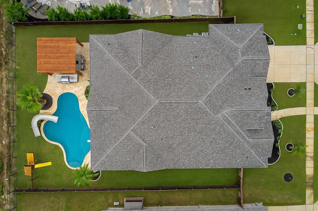 11504 Antler Ridge Way Argyle, TX 76226 - Photo 39 of 40 an aerial view of a house with a garden and lake view