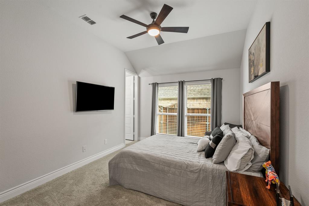 11504 Antler Ridge Way Argyle, TX 76226 - Photo 7 of 40 a bed room with a bed tv and a window