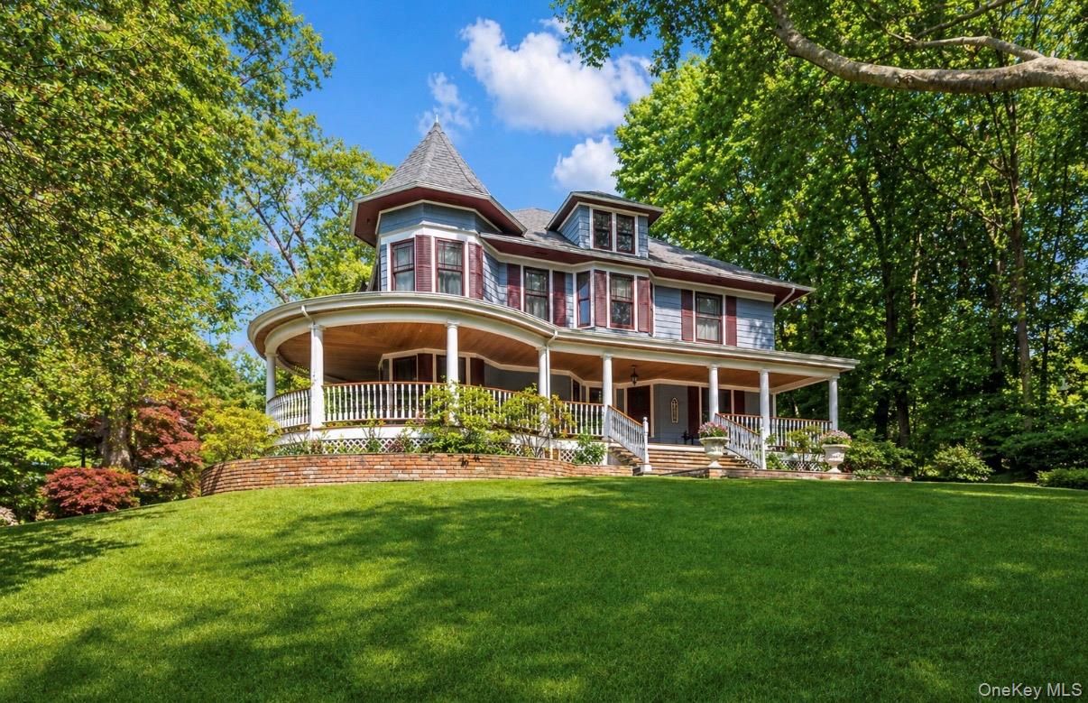 110 Red Spring Lane Glen Cove, NY 11542 - Photo 2 of 43 Victorian-style residence featuring a wraparound porch
