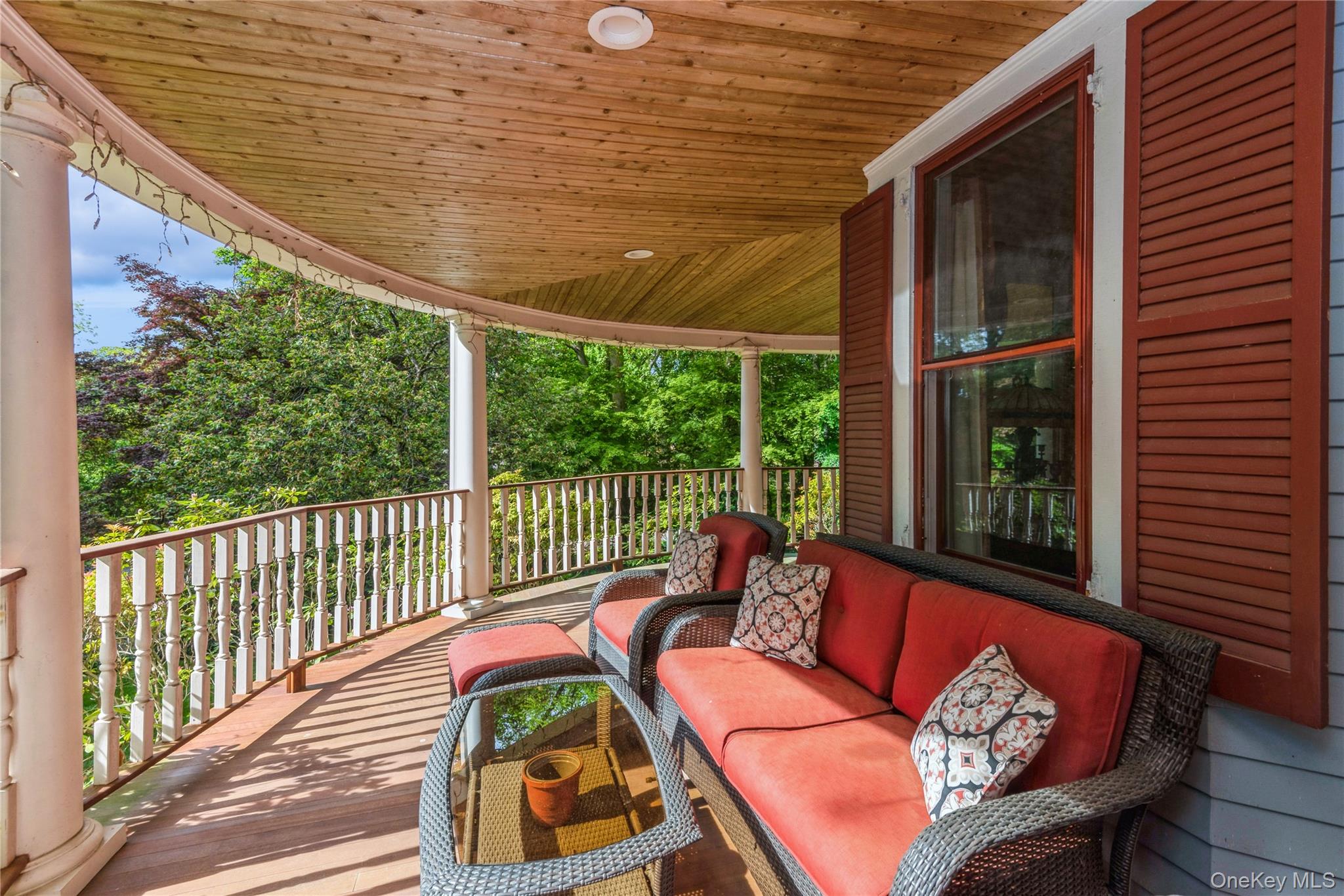 110 Red Spring Lane Glen Cove, NY 11542 - Photo 5 of 43 Wraparound, mahogany wood porch, featuring outdoor hangout area