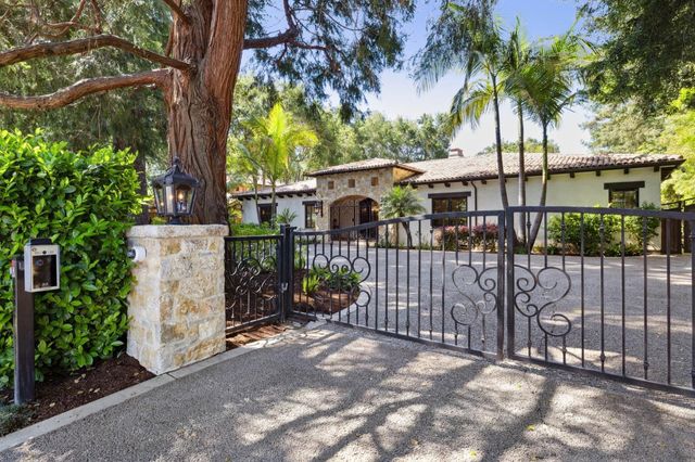 a view of a wrought iron fences in front of house