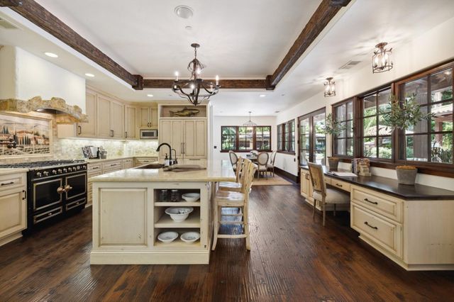 a kitchen with appliances cabinets and a counter top space