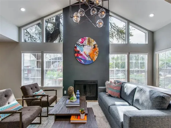 a living room with furniture and a large window
