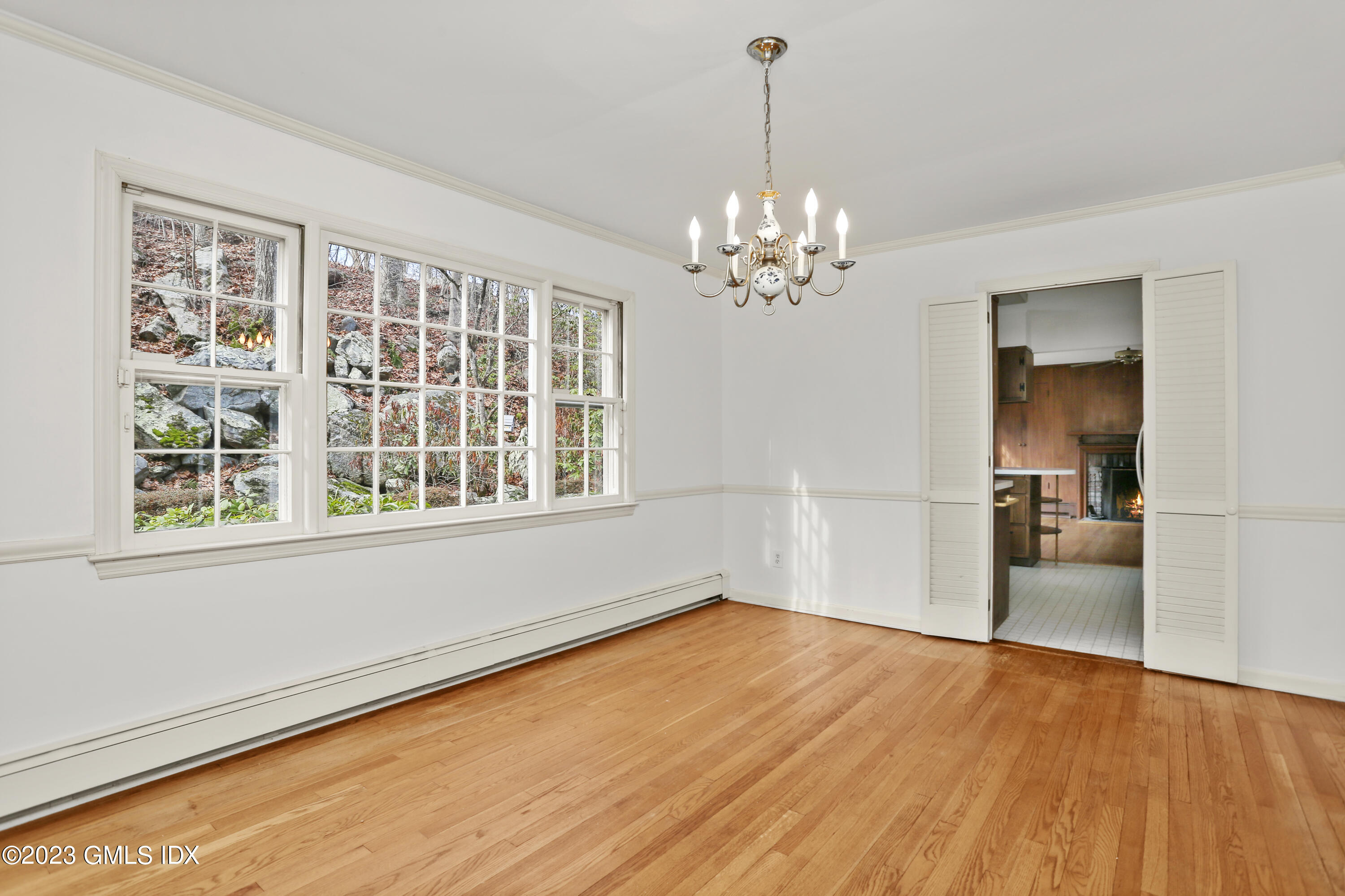 55 Frontier Road Cos Cob, CT 06807 - Photo 14 of 38 a view of empty room with wooden floor and kitchen view