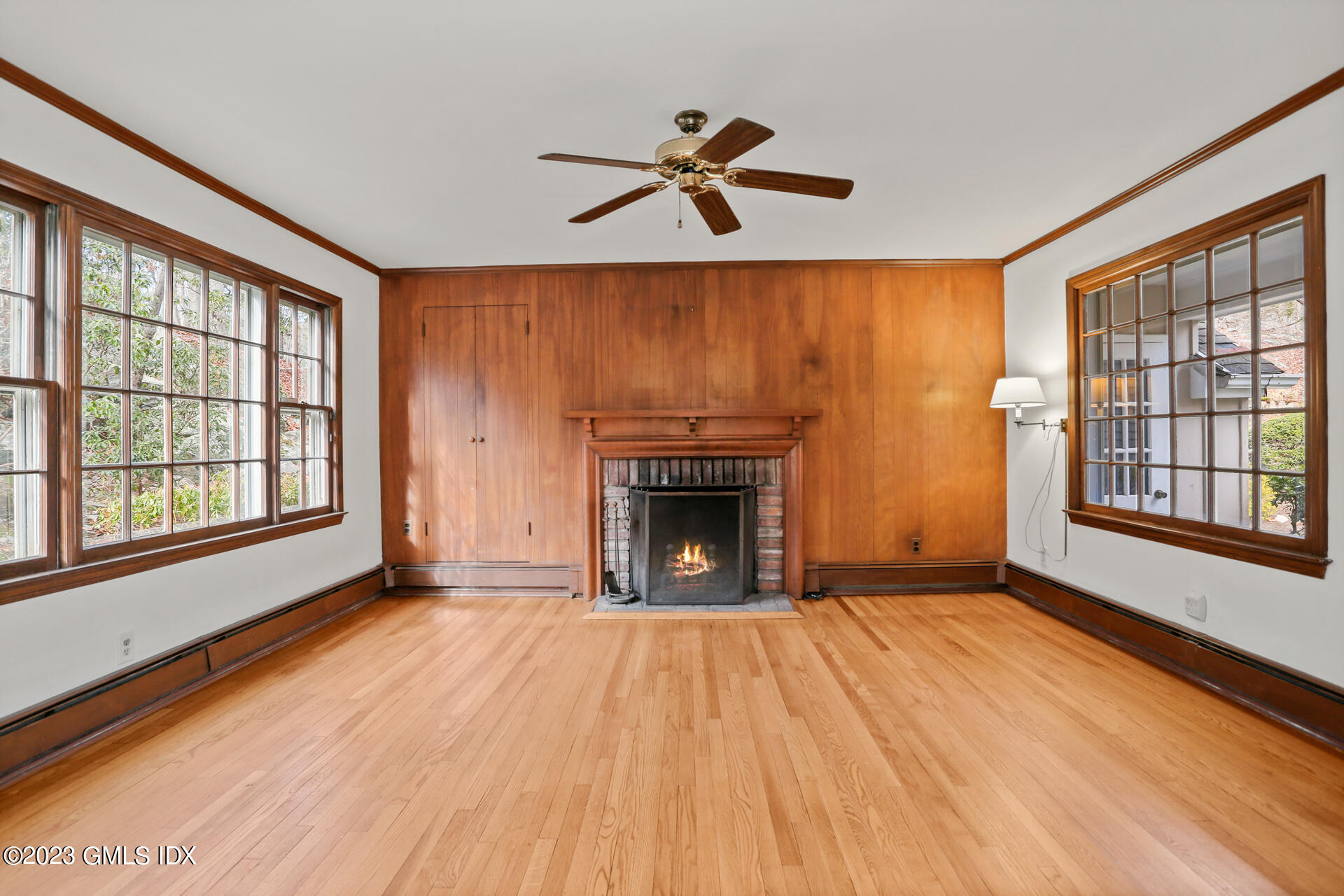 55 Frontier Road Cos Cob, CT 06807 - Photo 17 of 38 a view of an empty room with a fireplace and a window