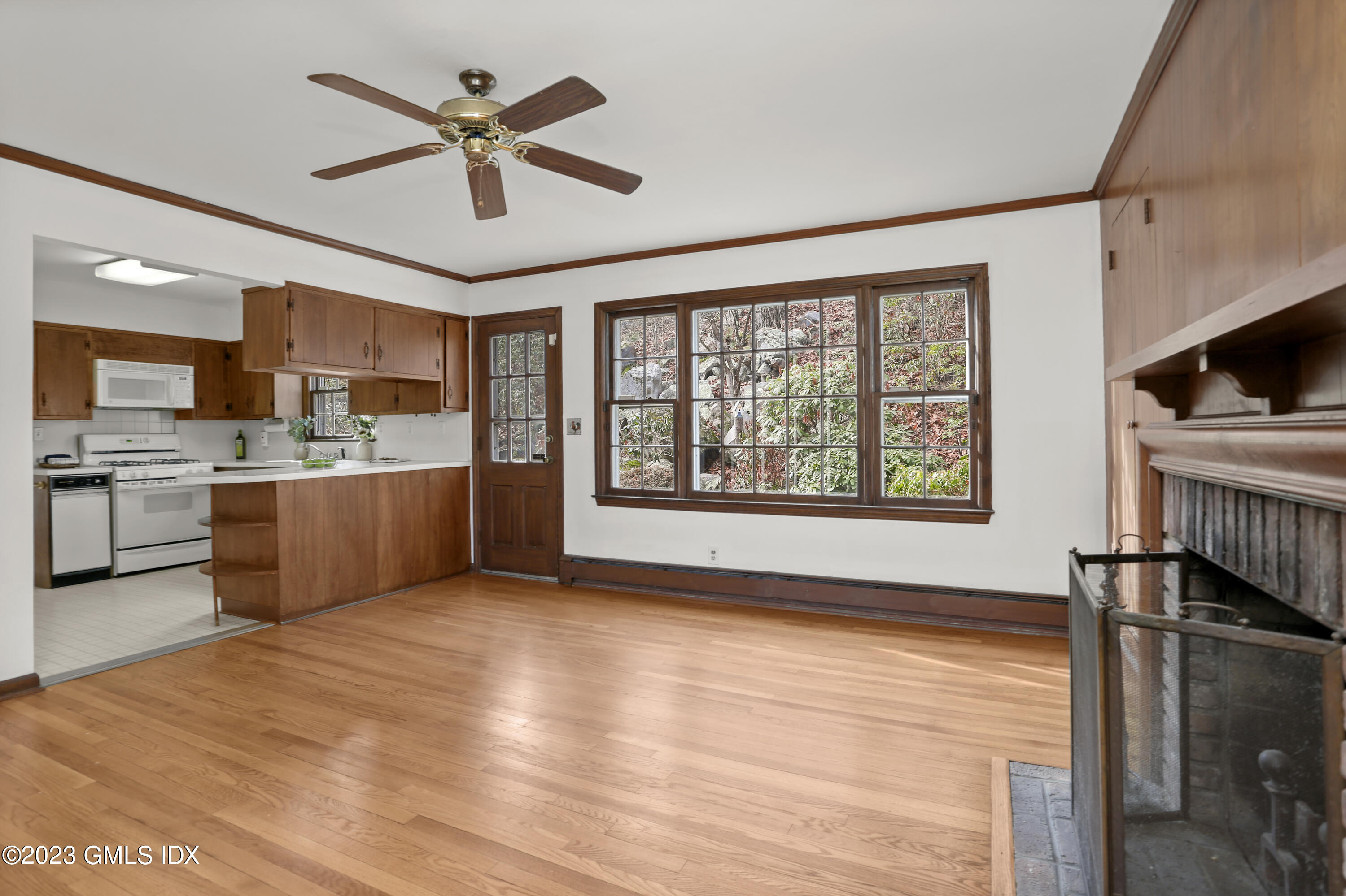 55 Frontier Road Cos Cob, CT 06807 - Photo 19 of 38 a view of kitchen with kitchen island wooden floor and window