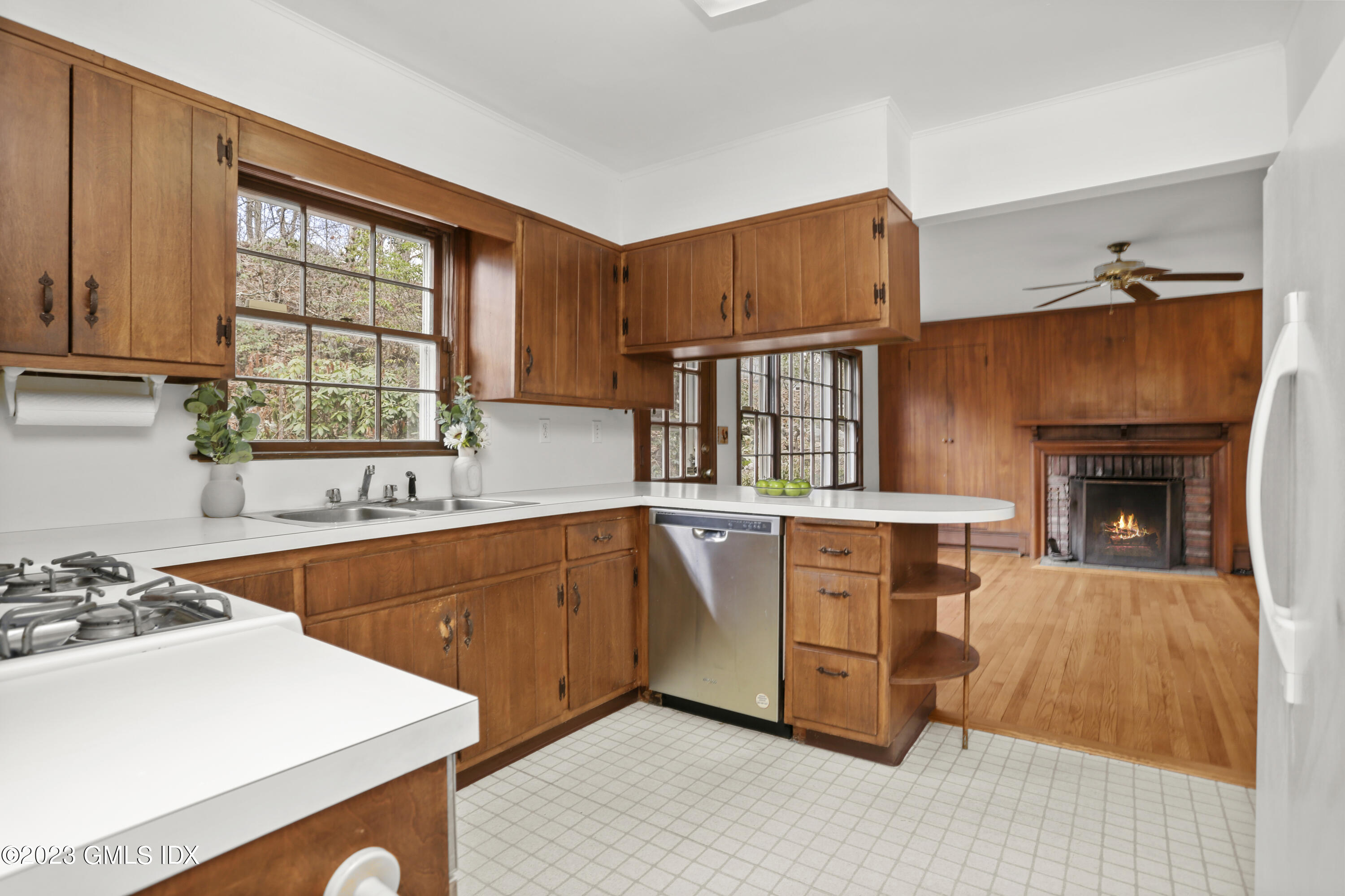 55 Frontier Road Cos Cob, CT 06807 - Photo 20 of 38 a kitchen with stainless steel appliances granite countertop a stove a sink and a refrigerator