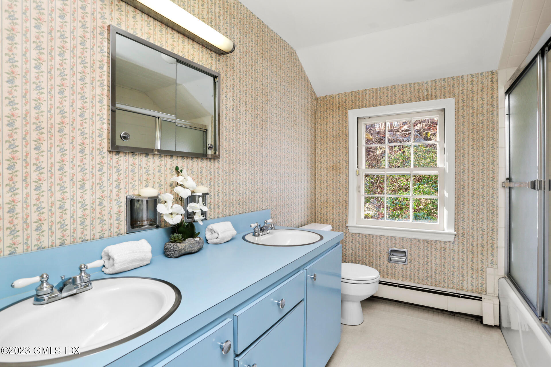55 Frontier Road Cos Cob, CT 06807 - Photo 30 of 38 a bathroom with a granite countertop toilet a sink and a mirror
