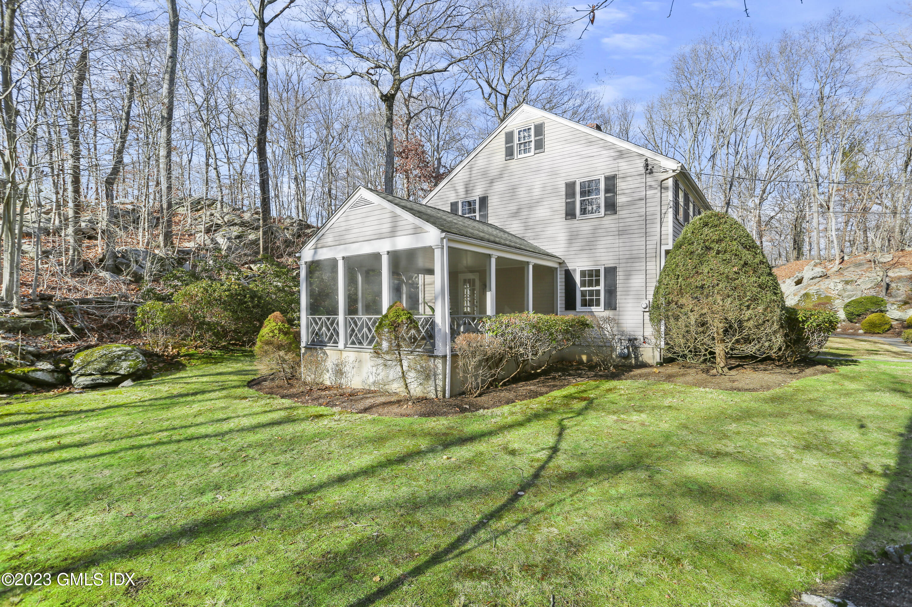 55 Frontier Road Cos Cob, CT 06807 - Photo 5 of 38 a front view of a house with garden