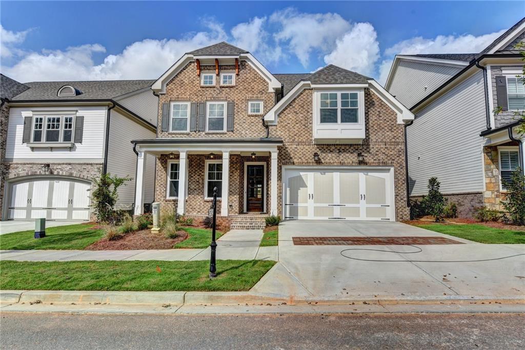 140 Crossing Way Johns Creek, GA 30022 - Photo 1 of 1 a front view of a house with a yard