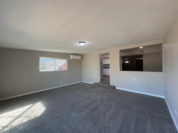 a view of an empty room with a window