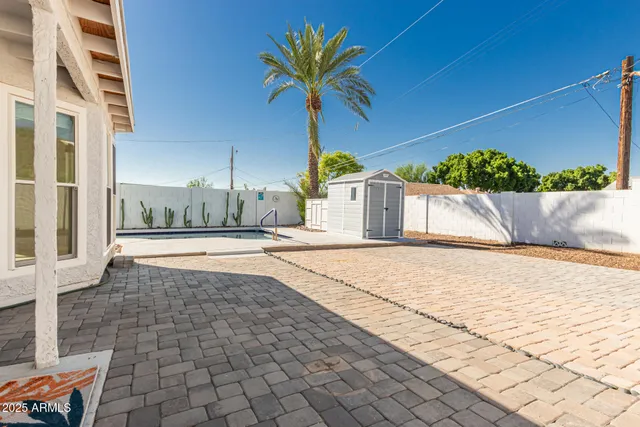 a view of a backyard of the house