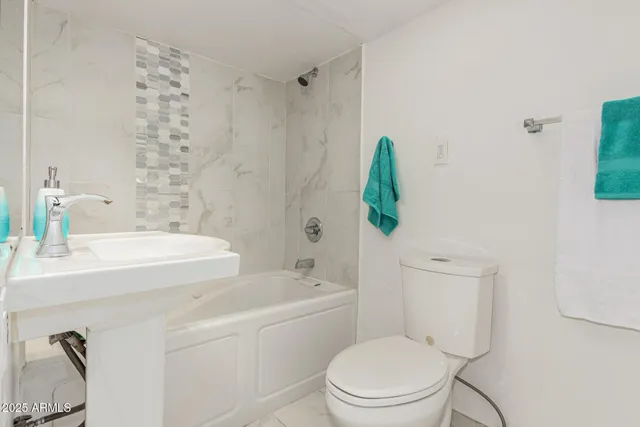 a view of a house with a barbeque and wooden floor