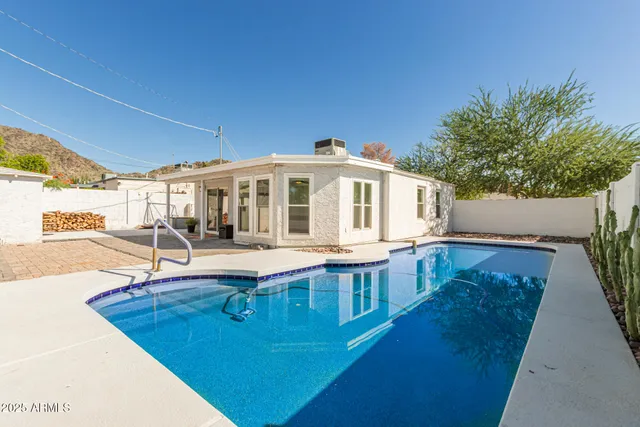 a view of swimming pool with a potted plant