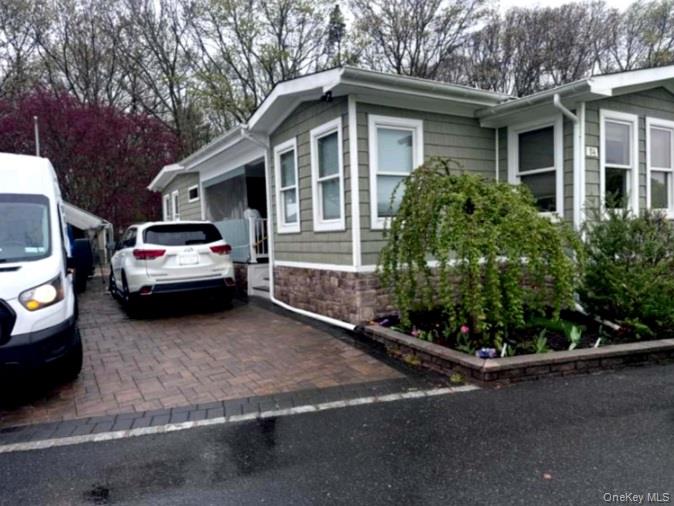 View of side of home with stone siding