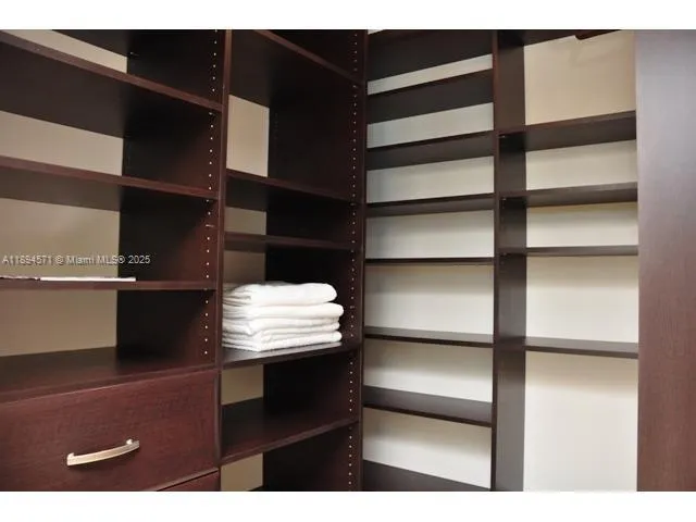 a large bathroom with a large tub and sink