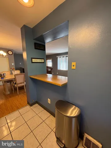 a room with wooden floor and gym equipment