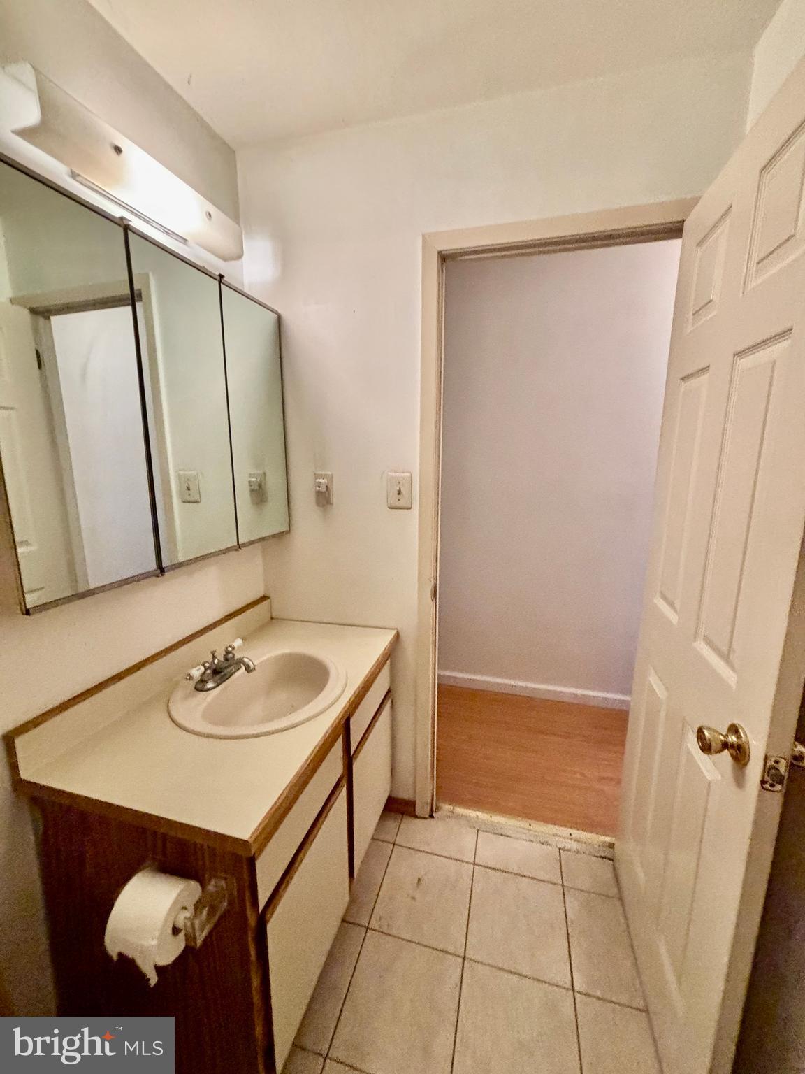 9336 Neil Road, Unit B Philadelphia, PA 19115 - Photo 23 of 37 a bathroom with a sink and a mirror