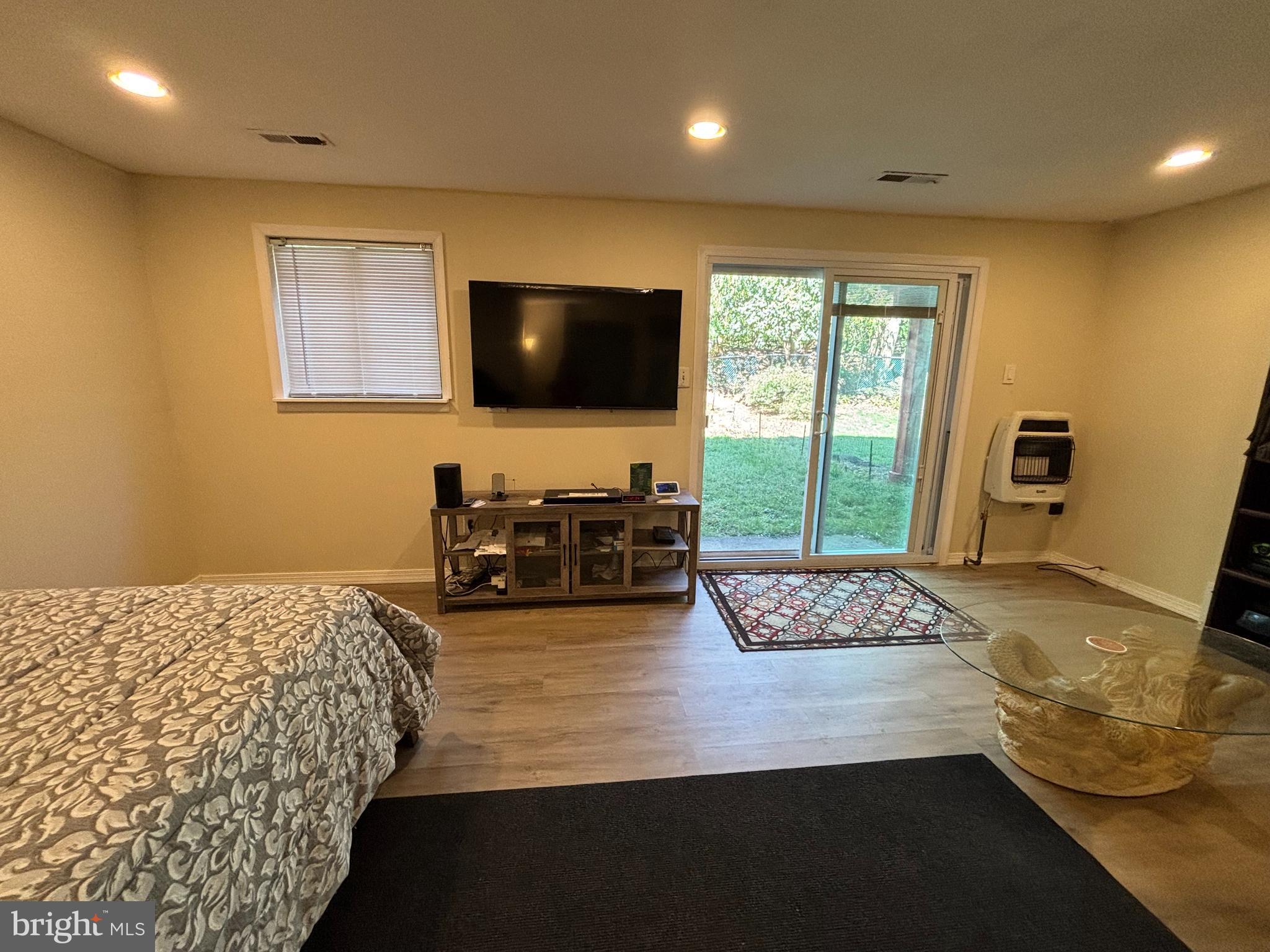 9336 Neil Road, Unit B Philadelphia, PA 19115 - Photo 26 of 37 a bedroom with a bed and a flat screen tv