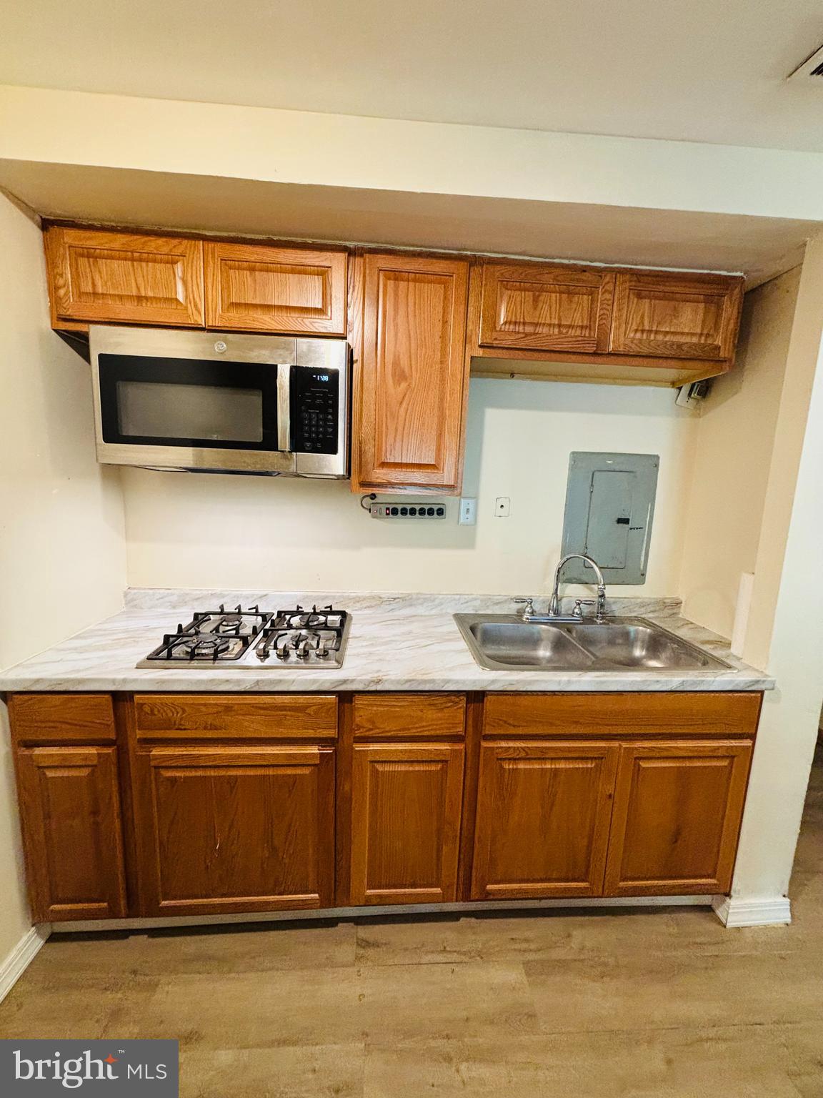 9336 Neil Road, Unit B Philadelphia, PA 19115 - Photo 28 of 37 a kitchen with a stove and a microwave