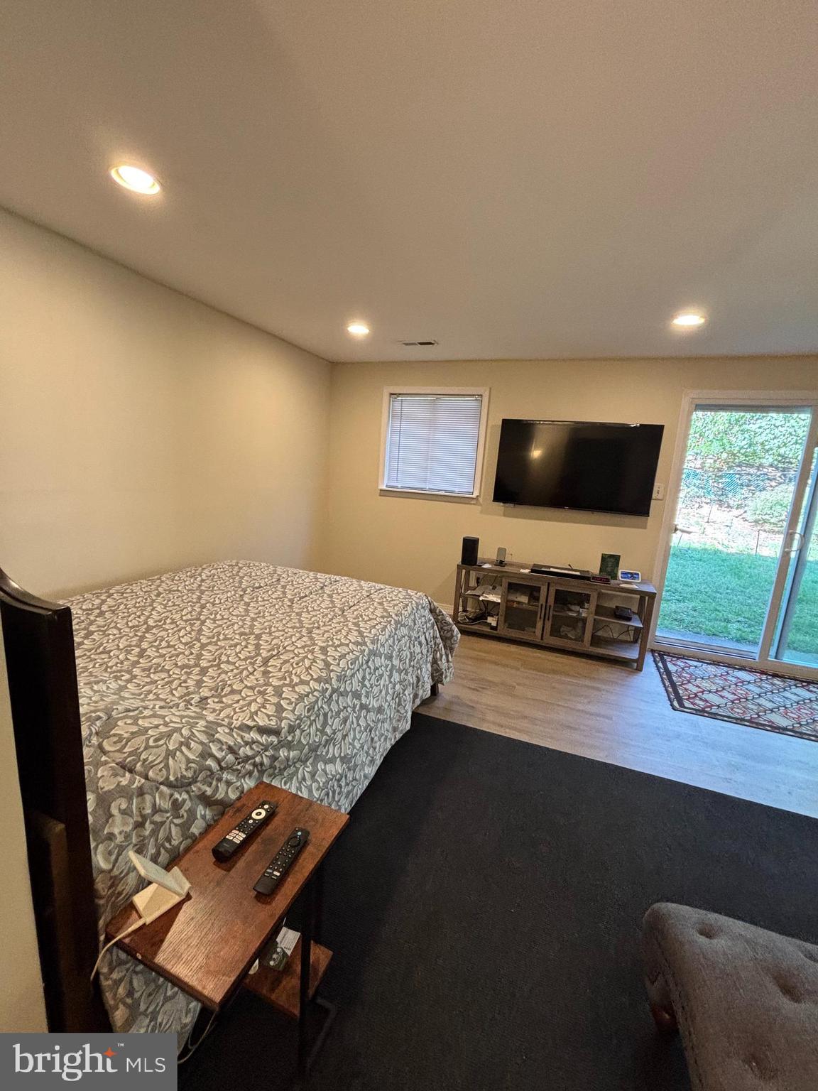 9336 Neil Road, Unit B Philadelphia, PA 19115 - Photo 30 of 37 a bedroom with a bed and a flat screen tv