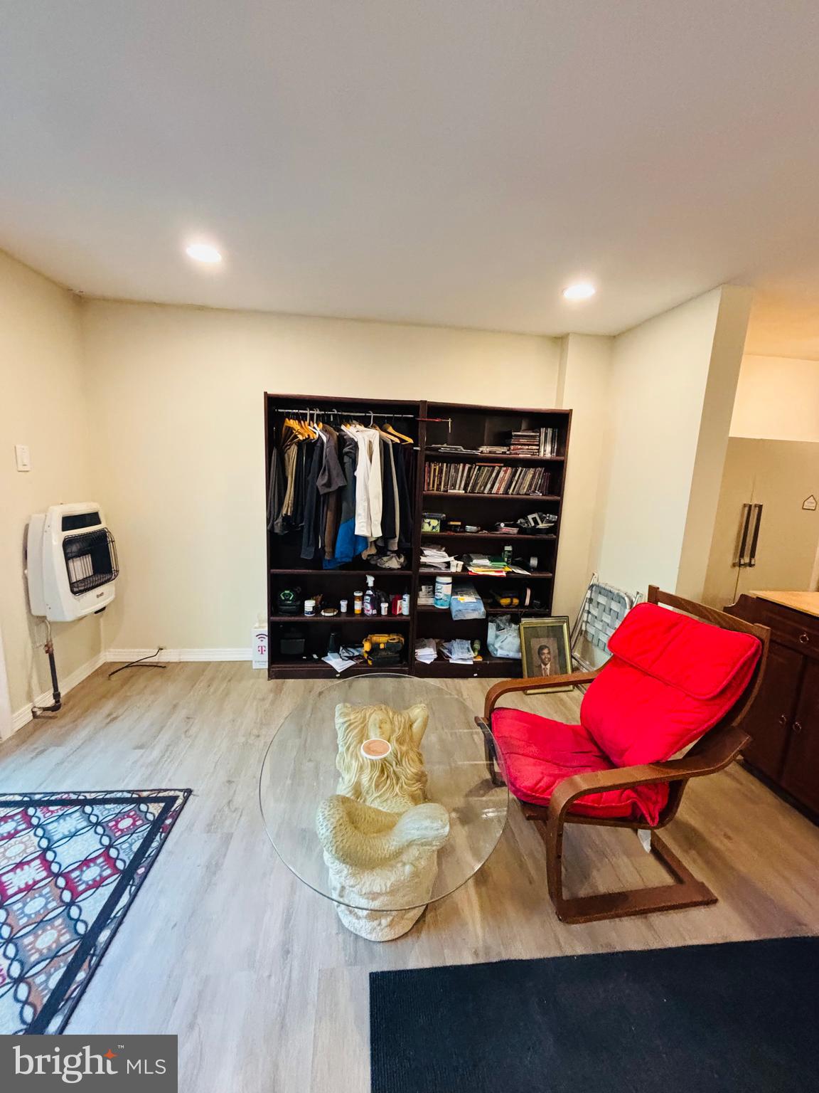 9336 Neil Road, Unit B Philadelphia, PA 19115 - Photo 32 of 37 a living room with furniture a rug and a wooden floor