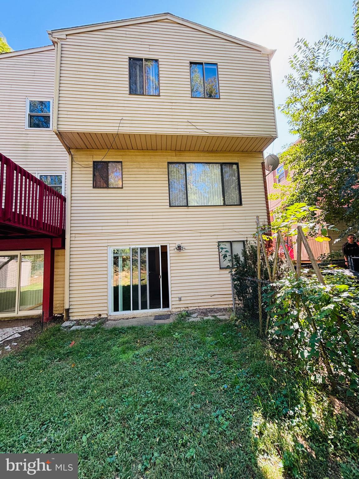 9336 Neil Road, Unit B Philadelphia, PA 19115 - Photo 37 of 37 a view of a house with brick walls and a yard with couches