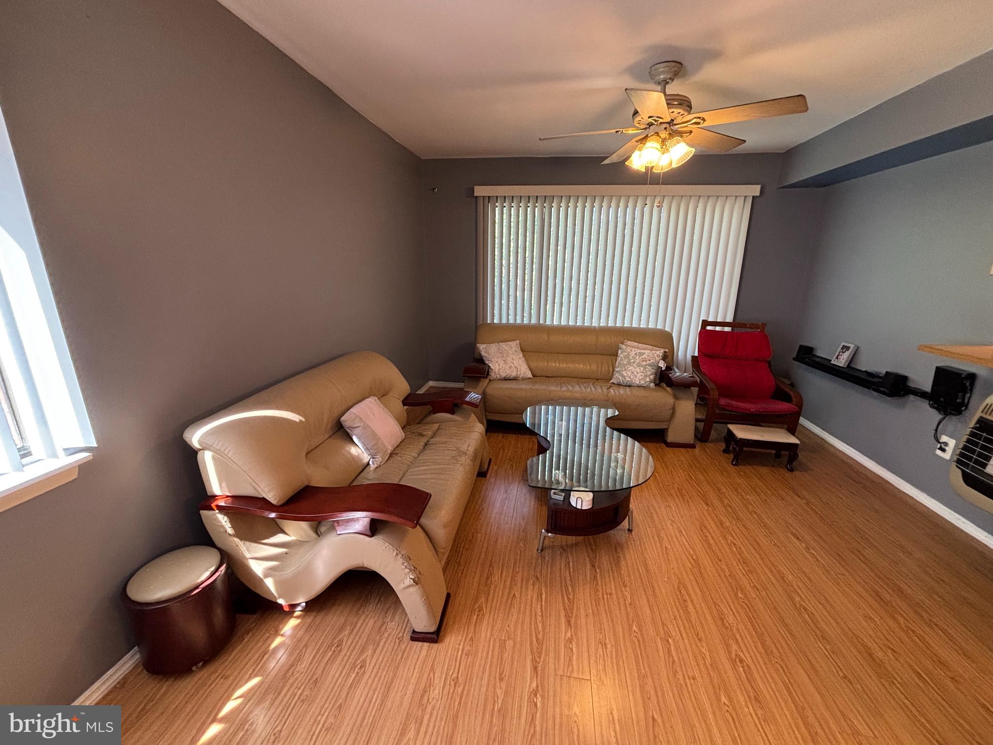 9336 Neil Road, Unit B Philadelphia, PA 19115 - Photo 7 of 37 a living room with furniture and a large window