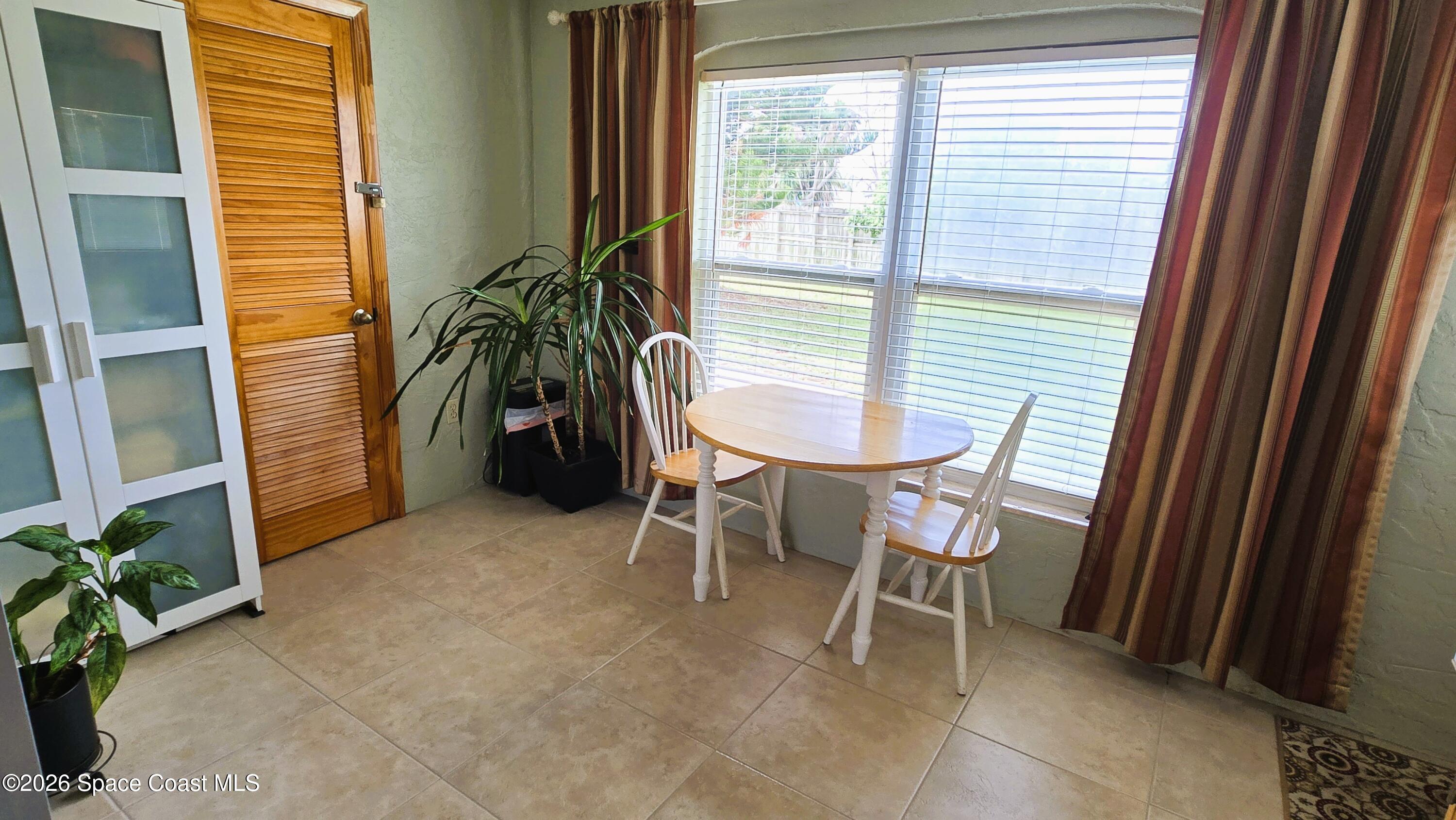 412 School Road, Unit 88 Indian Harbour Beach, FL 32937 - Photo 18 of 50 Enclosed porch / Windows