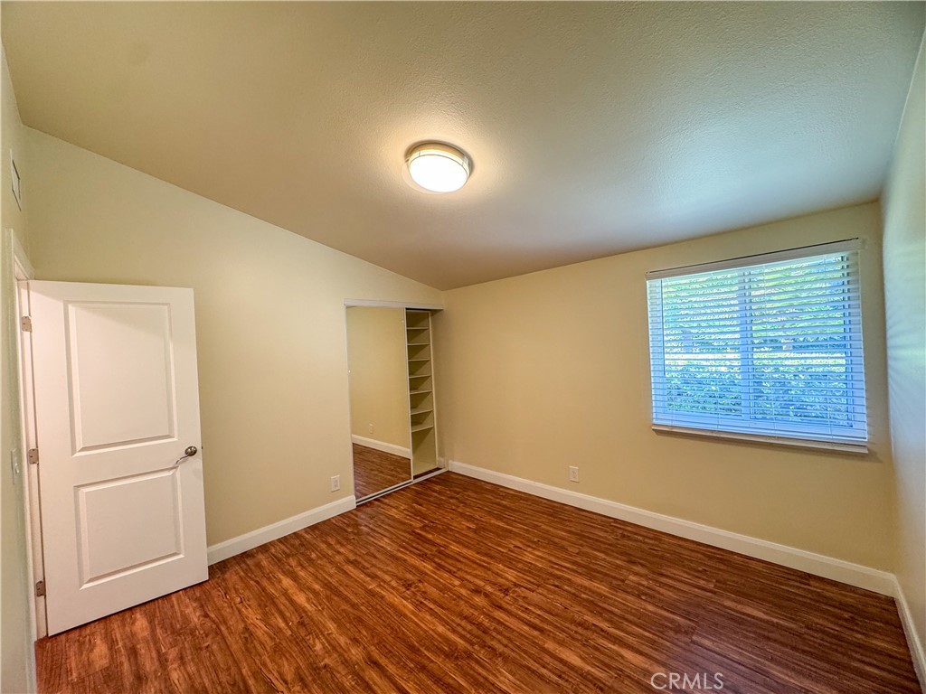12162 Bradford Place Granada Hills, CA 91344 - Photo 15 of 27 an empty room with wooden floor and windows